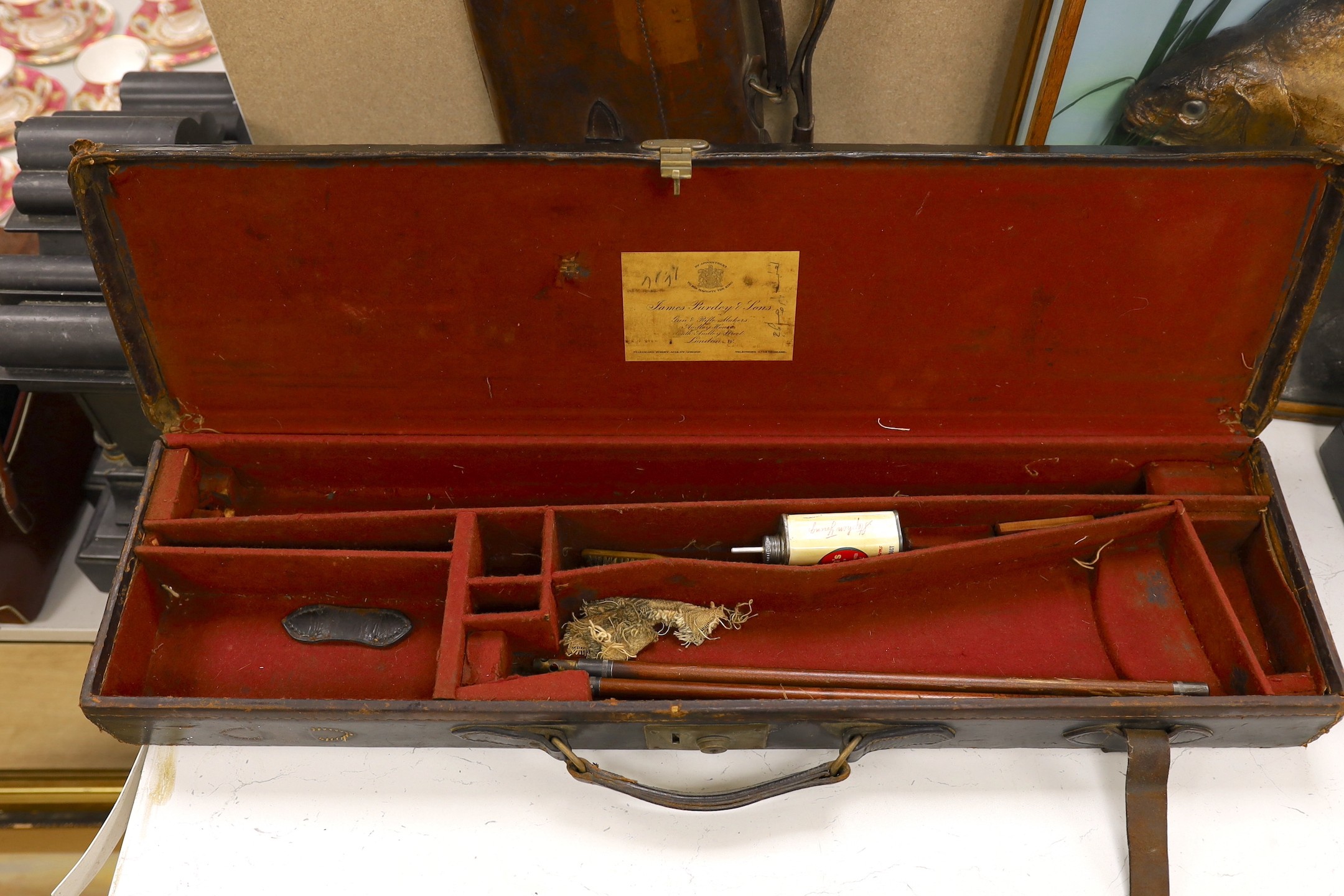 A James Purdey & Sons leather gun case and another brown leather gun case